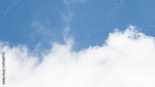 White cumulus clouds and blue sky