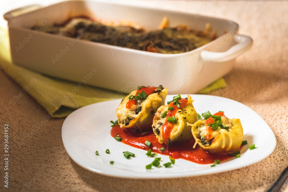 shell-shaped pasta stuffed with spinach and cheese shell-shaped pasta stuffed with spinach and cheese