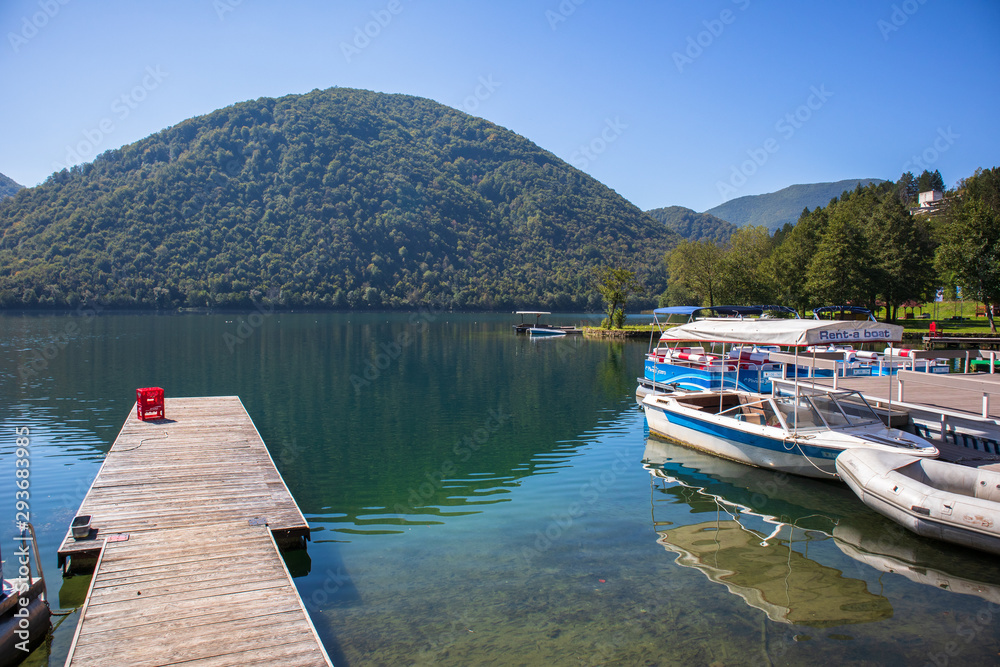 Marina with small tourist boats by the Pliva lakes near the Jajce in Bosnia and Herzegovina