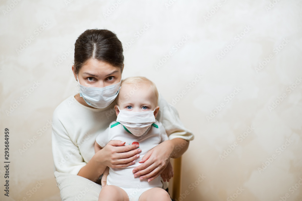mother and her little daughter in medical masks