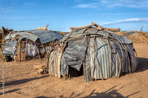 Poor huts in traditional african Dassanech village, Omo river, Ethiopia indigenous people houses photo