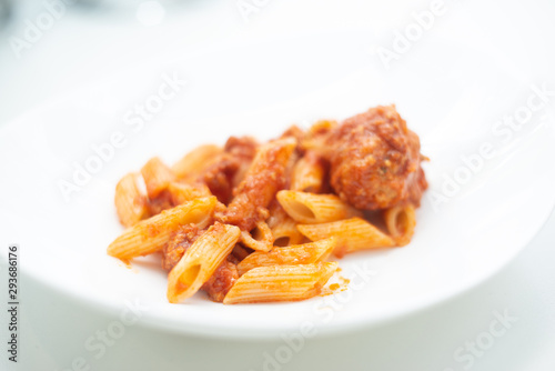 Italian pasta with tomato sauce and meatballs