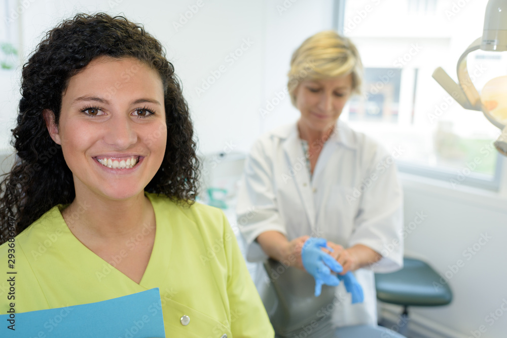 portrait of a young attractive dentist assistant portrait of a young attractive dentist assistant