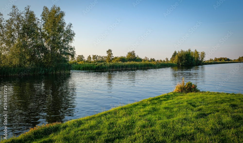 Dutch scenery with boats and trees in amsterdam