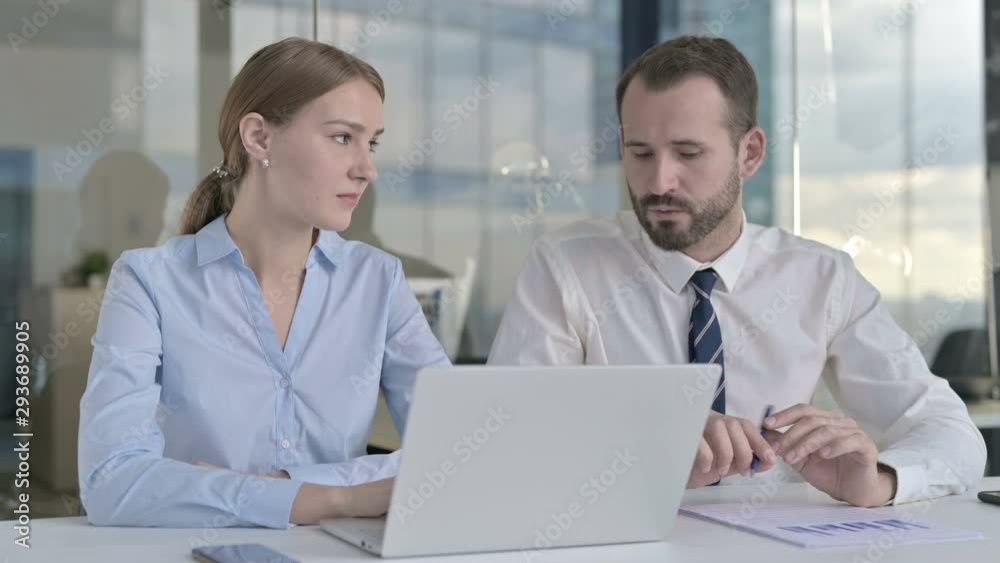 Executive Business people Discussing on Laptop Screen in Office Executive Business people Discussing on Laptop Screen in Office