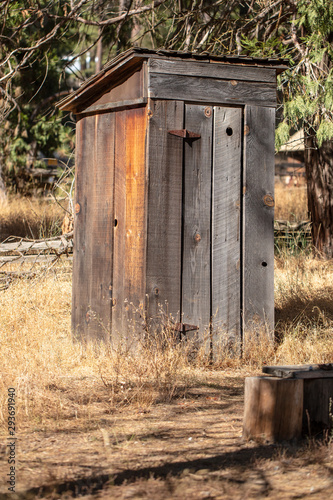 Old wood outhouse with a tin roof