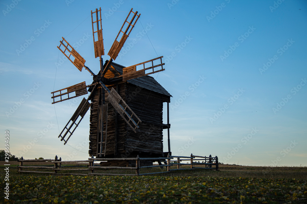 old wooden windmill in the village