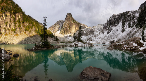 Beautiful View of a Glacier Lake in the Canadian Mountain Landscape during a colorful and vibrant sunset in Fall Season. Taken in Watersprite Lake, Squamish, North of Vancouver, BC, Canada. photo