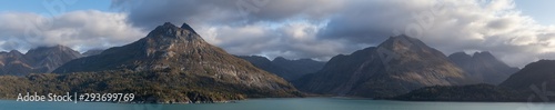 Beautiful Panoramic View of American Mountain Landscape on the Ocean Coast during a cloudy and colorful morning in fall season. Taken in Glacier Bay National Park and Preserve, Alaska, USA.