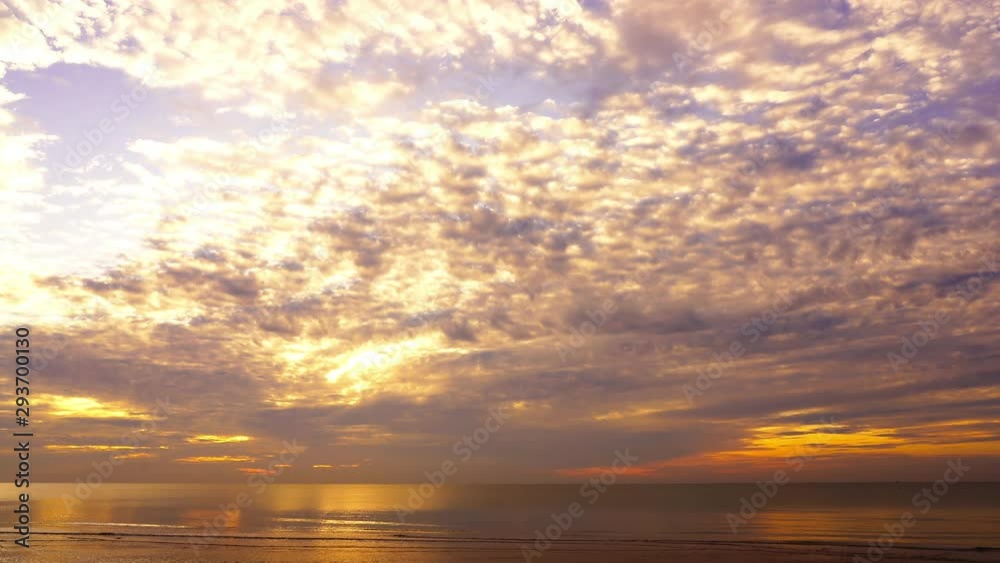 Dramatic cloudscape formed while the sun is setting on the ocean horizon. Dramatic cloudscape formed while the sun is setting on the ocean horizon.