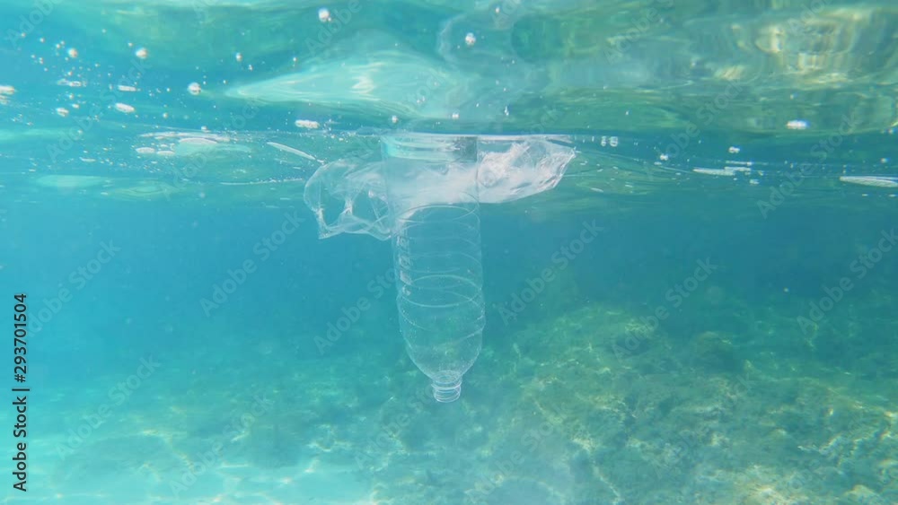 Plastic pollution in sea ocean - big environmental problem. Plastic bag ...