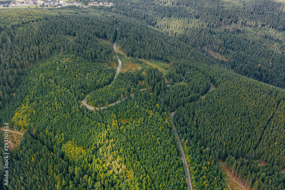 Aerial drone photography of a road in the mountains, top-down view. Poland, Czech Republic border. 