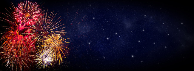 Fireworks on blue background with stars and space for text