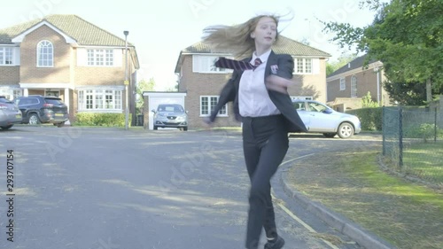 Senior school girl practising ballet on the way to school themes of ballet carefree routines education 