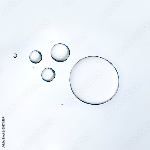 Cosmetic liquid or water serum on white background