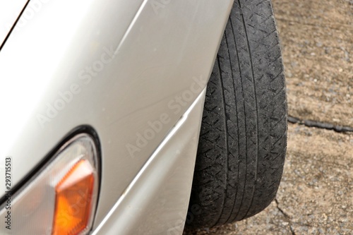 Worn out tyre concept. Danger of using a worn out tyre with very little tread remaining.