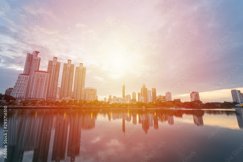 Fototapeta premium City building with water reflection before sunset