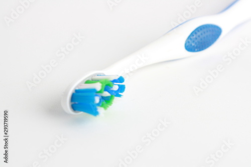 blue and green white toothbrush