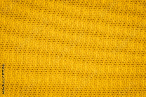 Texture of real yellow knitwear, textile background. Abstract background