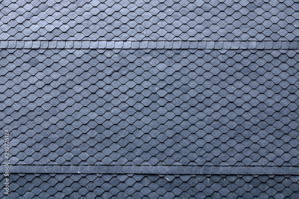 Aged slate roof tiles close-up Aged slate roof tiles close-up