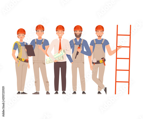 Team of builders in gray overalls and blue shirts with tools in their hands next to the stairs.