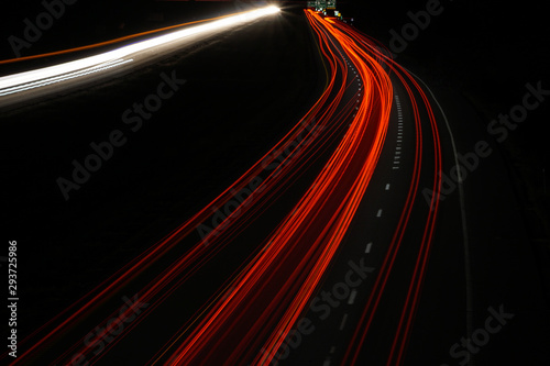 tail light trails on the highway at night