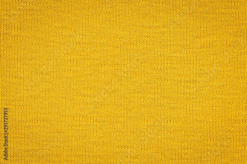 Texture of real yellow knitwear, textile background. Abstract background