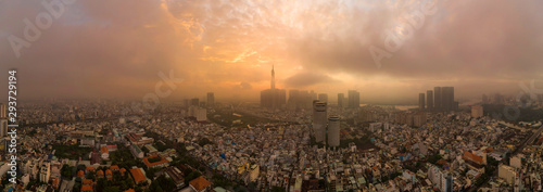 Beautiful aerial urban sunrise in Southeast Asia due to an extreme air pollution level. Ho Chi Minh City, Vietnam has a population of ten million and a manufacturing sector with strong economic growth photo