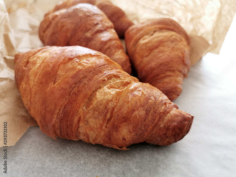 Croissants on a bakery bag. French pastry.
