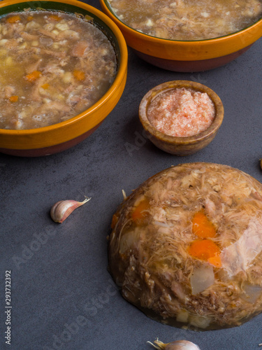 Homemade jelly meat with mustard, garlic on the table. Holodets, traditional Russian food photo