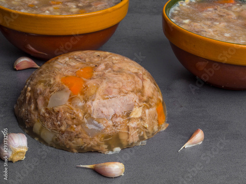 Homemade jelly meat with mustard, garlic on the table. Holodets, traditional Russian food photo