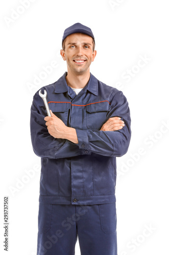 Male car mechanic on white ...