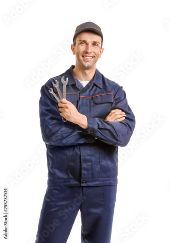 Male car mechanic on white ...