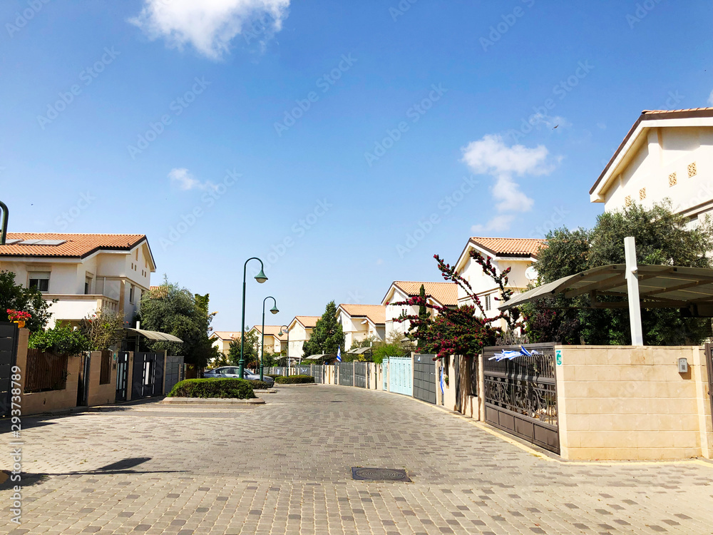 HOLON, ISRAEL April 02, 2019: Private houses, trees and streets in Holon, Israel HOLON, ISRAEL April 02, 2019: Private houses, trees and streets in Holon, Israel
