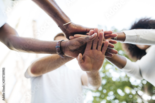Intercultural hand connection between friends