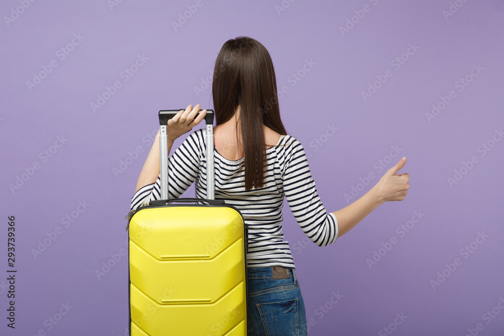 Φωτογραφία Traveler tourist woman girl in casual striped clothes posing isolated on violet purple background studio portrait