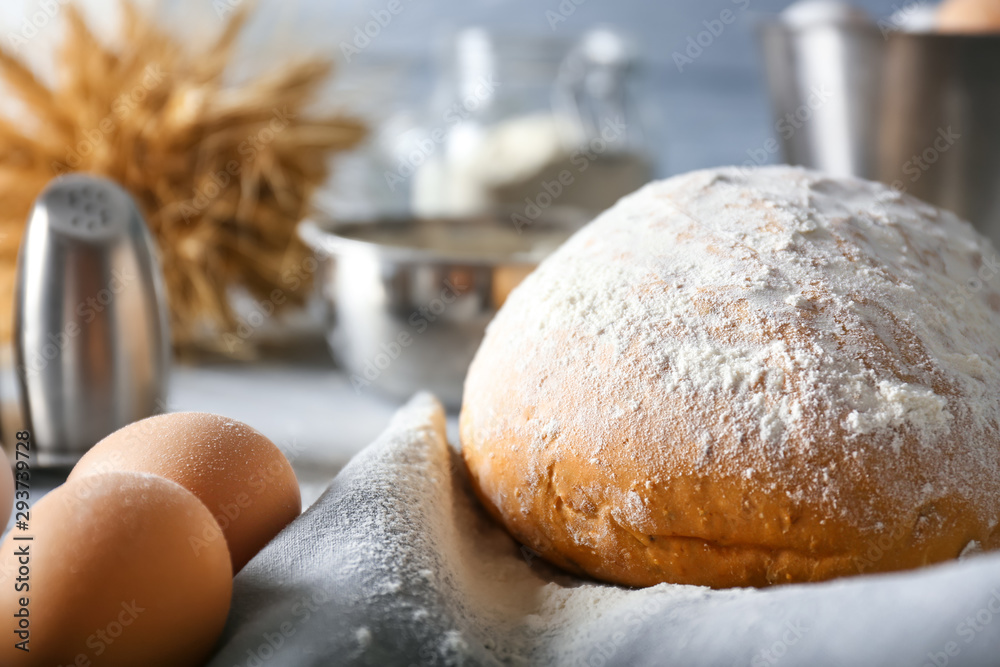 Fresh bread with raw eggs on table Fresh bread with raw eggs on table