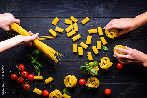 Female hands making fresh homemade pasta