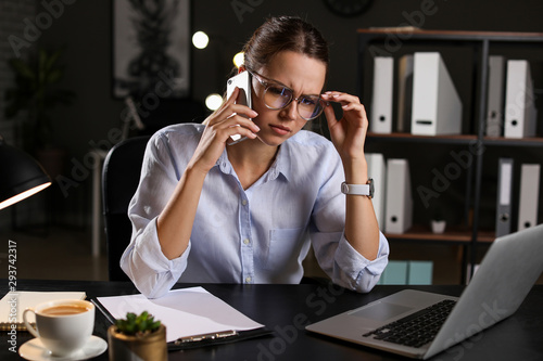 Tired businesswoman trying ...