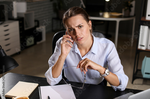 Tired businesswoman trying ...