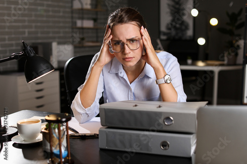 Tired businesswoman trying ...