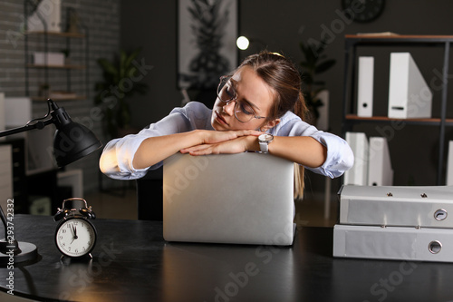 Tired businesswoman trying ...