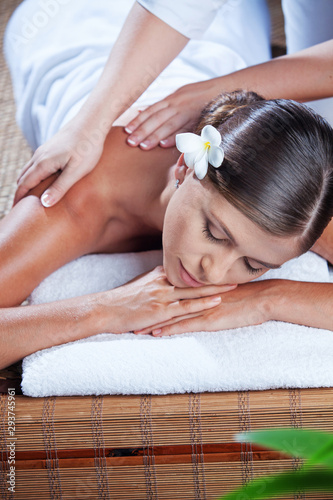 portrait of young beautiful woman in spa environment. 