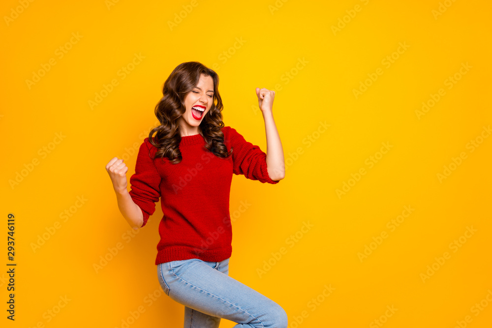 Photo of trendy cheerful charming nice fascinating girlfriend wearing jeans denim making fists rejoicing with victory isolated over vivid color background Photo of trendy cheerful charming nice fascinating girlfriend wearing jeans denim making fists rejoicing with victory isolated over vivid color background