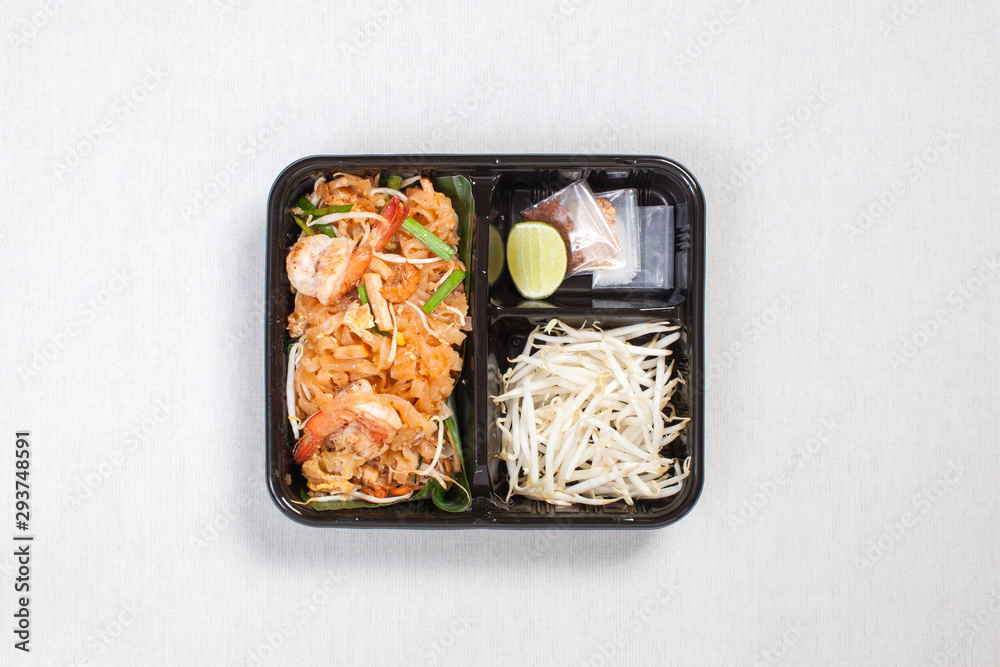 Pad Thai Goong Sod with Bean sprouts put in black plastic box, put on a white tablecloth, food box, Thai food. Pad Thai Goong Sod with Bean sprouts put in black plastic box, put on a white tablecloth, food box, Thai food.