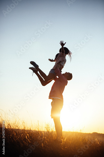 Young man toss up his woman to the sky they send Genuine emotions  to the world.