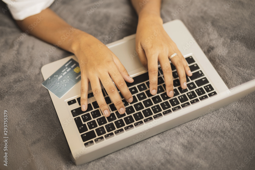 Fototapeta premium Hand writing on laptop on grey background