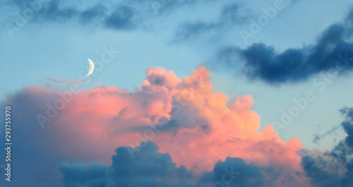 new moon with rose tinted clouds