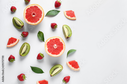 Sweet ripe fruits and berries on white background