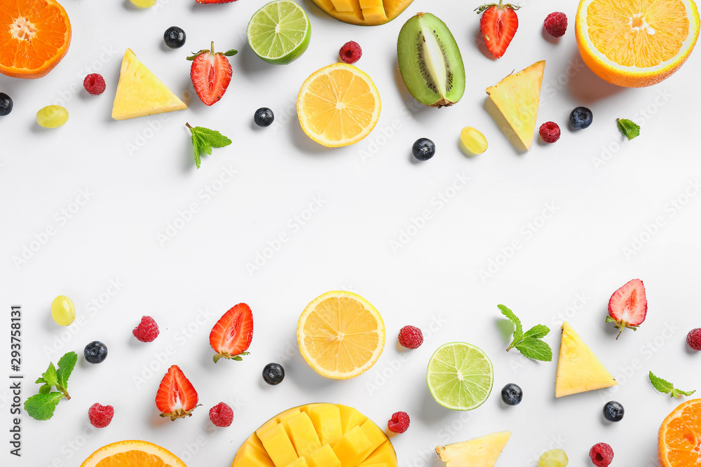 Naklejka Sweet ripe fruits and berries on white background